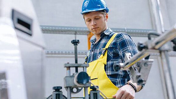 A mechanic inspecting a machine