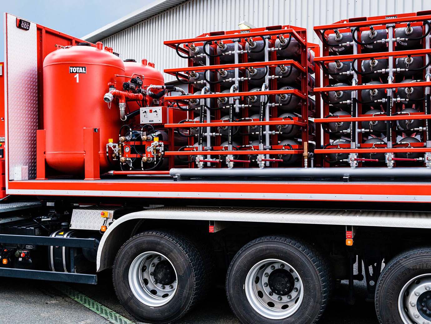 Truck carrying rows of fire extinguishers
