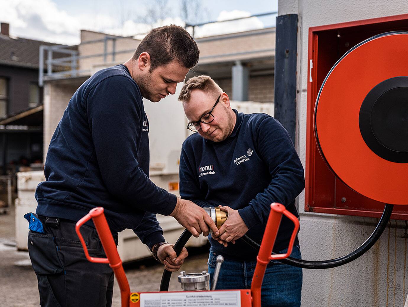 Two Johnson Controls technicians working with extinguishing water systems