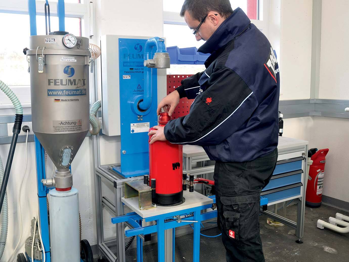 Firefighter inspecting a fire extinguisher