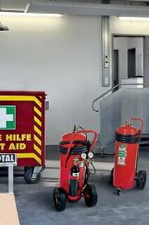 Fire extinguishers and first aid kit in a warehouse