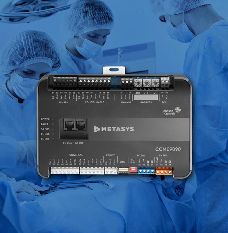 Metasys controller with background image of three surgeons performing in the operations theater