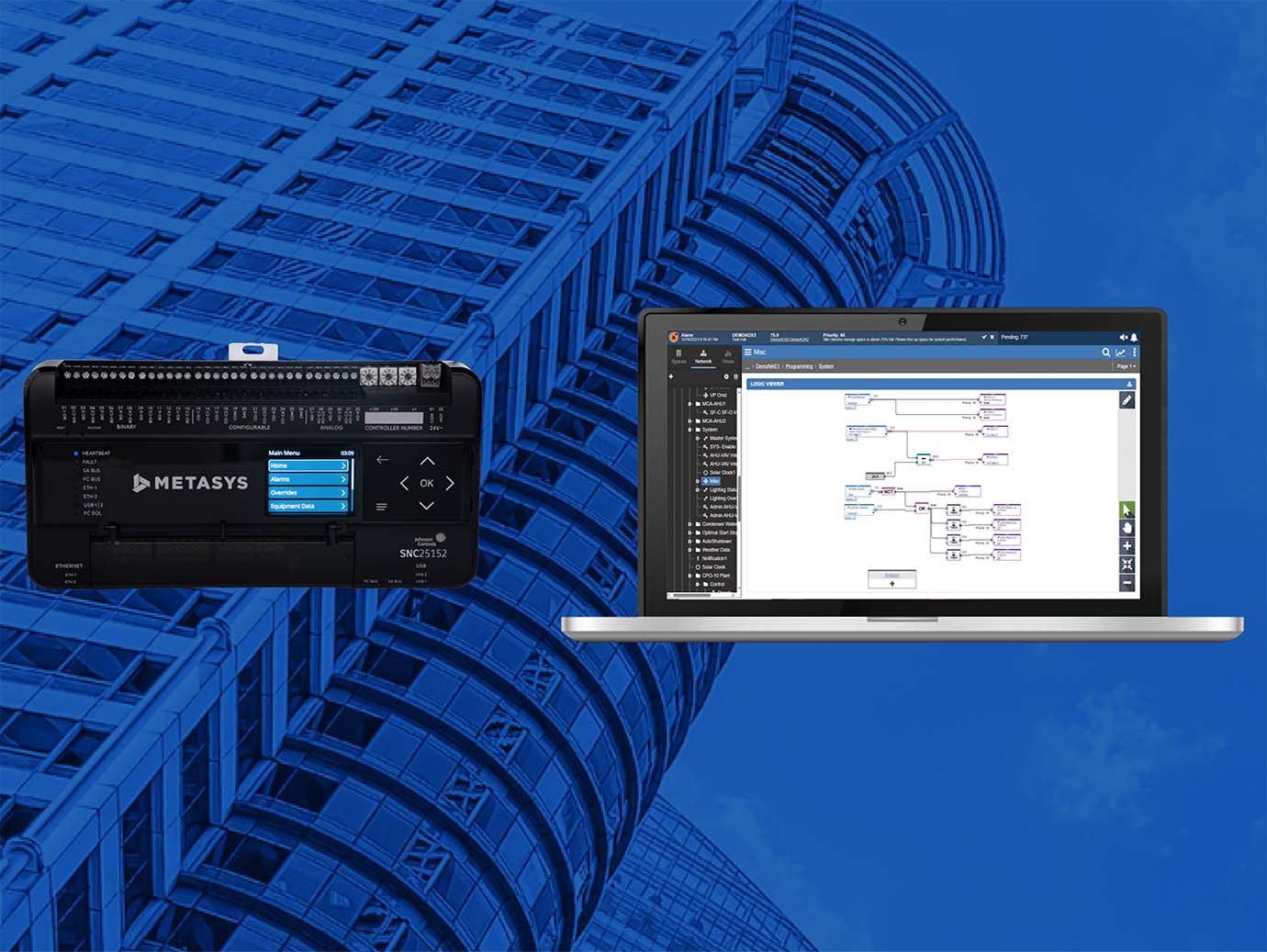 Metasys Controller using laptop with background of Frog's eye view of skyscrapers in blue light