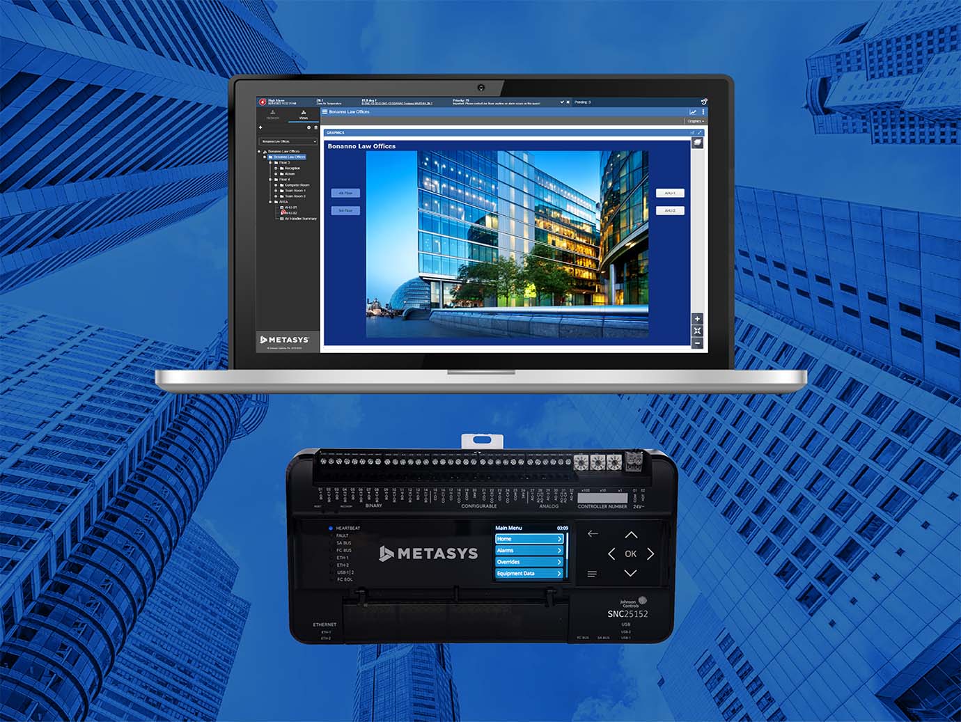 Display of Metasys Controller using laptop with background of Frog's eye view of skyscrapers in blue light