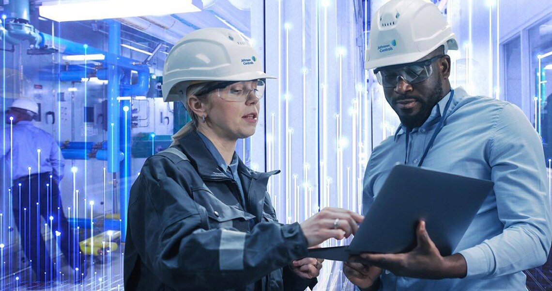 Two engineers wearing safety helmet and discussing work with an overlay of openblue graphics