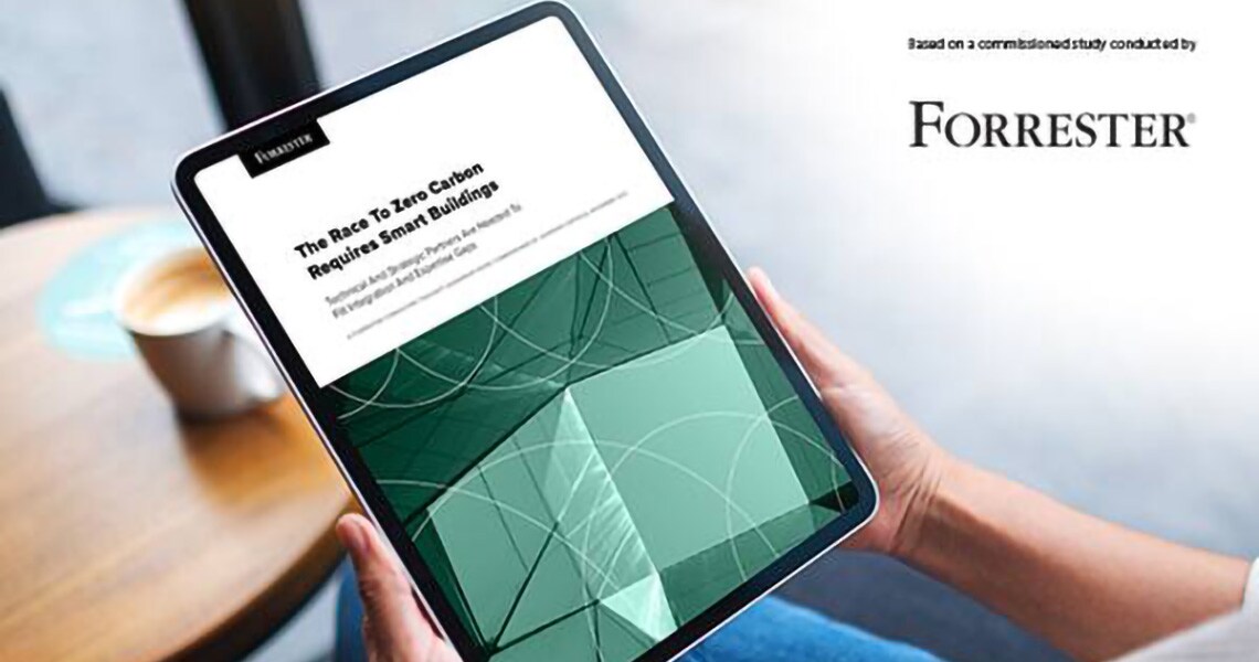 A handheld tablet displaying an article by Forrester with the Forrester logo superimposed in the right upper corner of the image