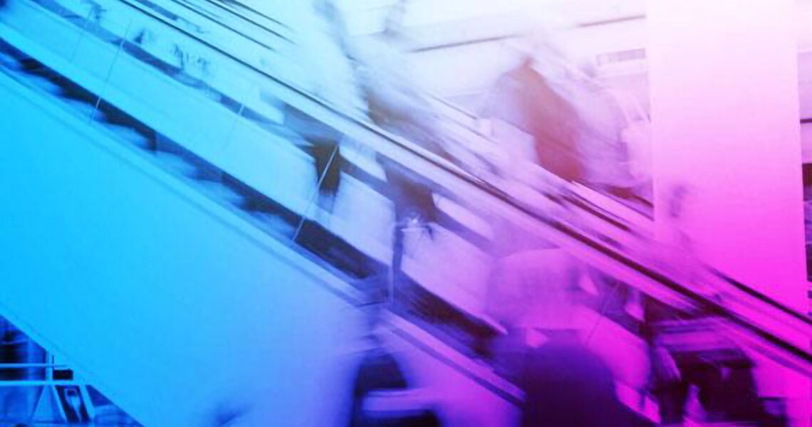 Motion-blur image of commuters walking with an escalator in the background overlaid by a blue and purple gradient