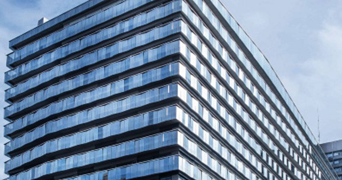Exterior of a high-rise commercial building with glass exteriors