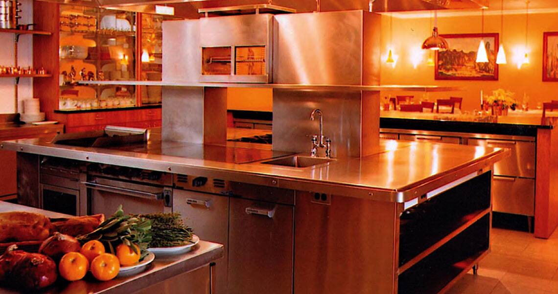 Fire protection tools installed in a commercial kitchen overlooking a dining space