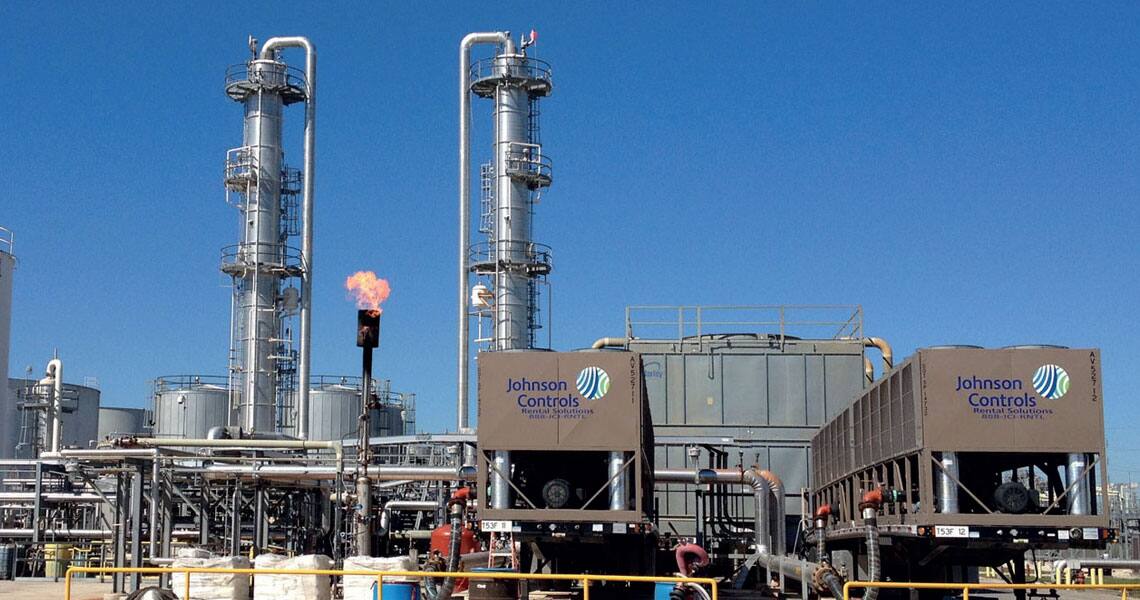 Heavy Johnson Controls equipment parked in an oil refinery