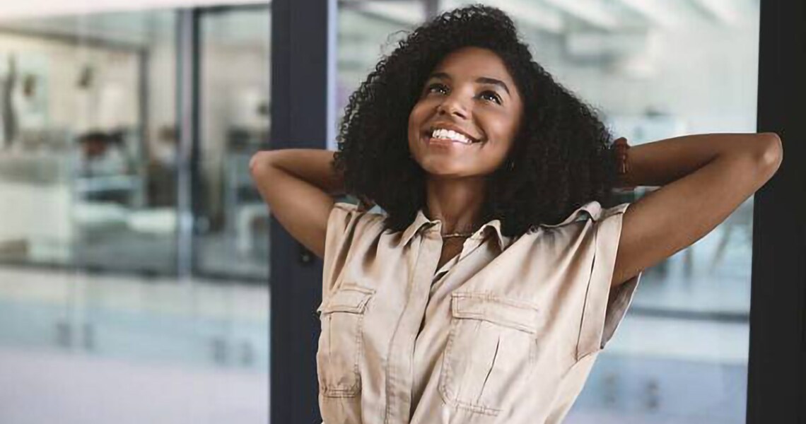 Woman smiling and relaxing in office