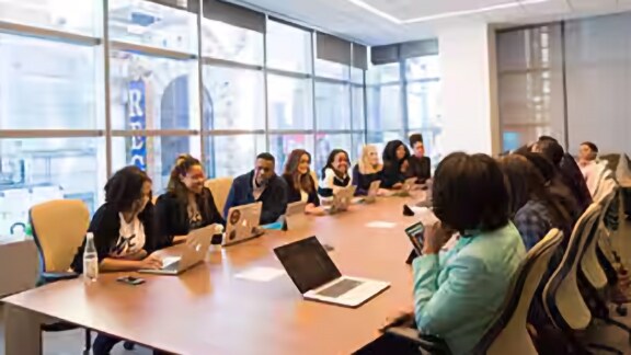 Group of employees having a meeting in an office room