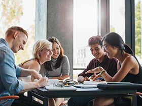 Group of friends are smiling while a study discussion
