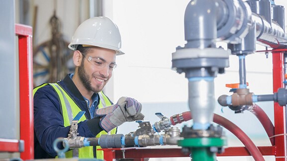 Employee working on pipe system