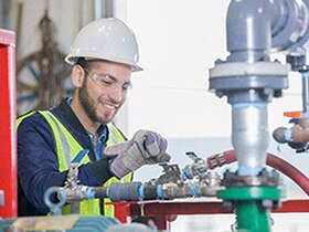 Man is smiling and working