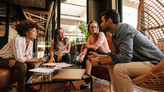 Group of multi ethnic team meeting in office